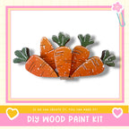 a DIY wood paint kit, with a focus on a wooden carrot decoration.