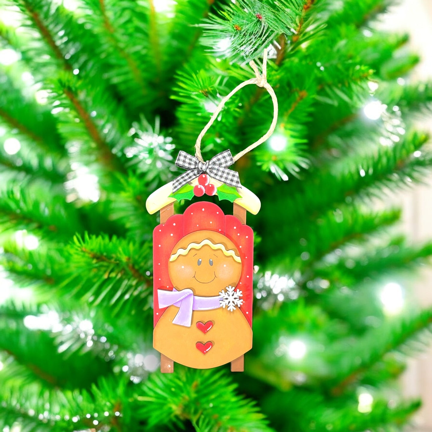 a christmas ornament hanging from a christmas tree