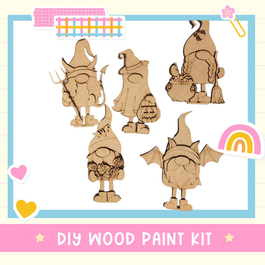 The image is a DIY wood paint kit featuring five wooden gnome characters in various poses, including one holding a lantern.