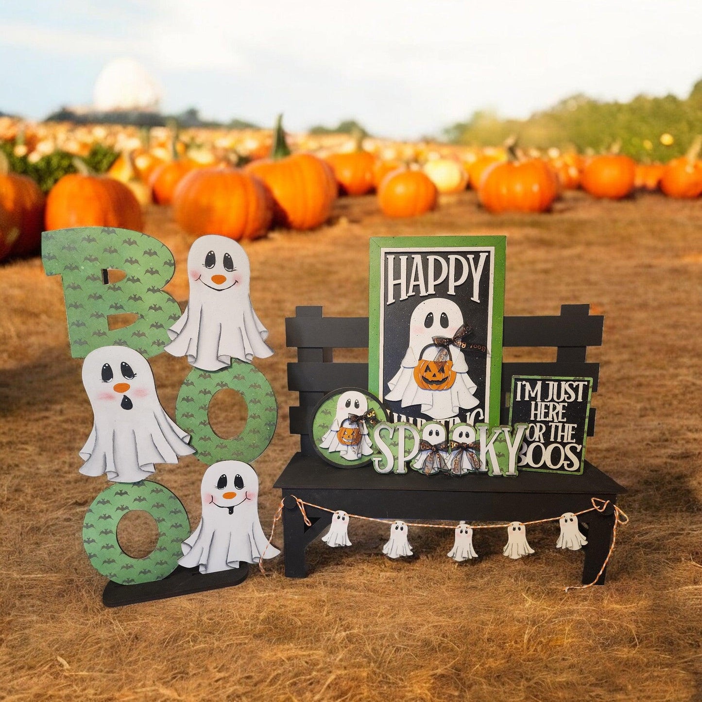 a couple of halloween decorations sitting on top of a field