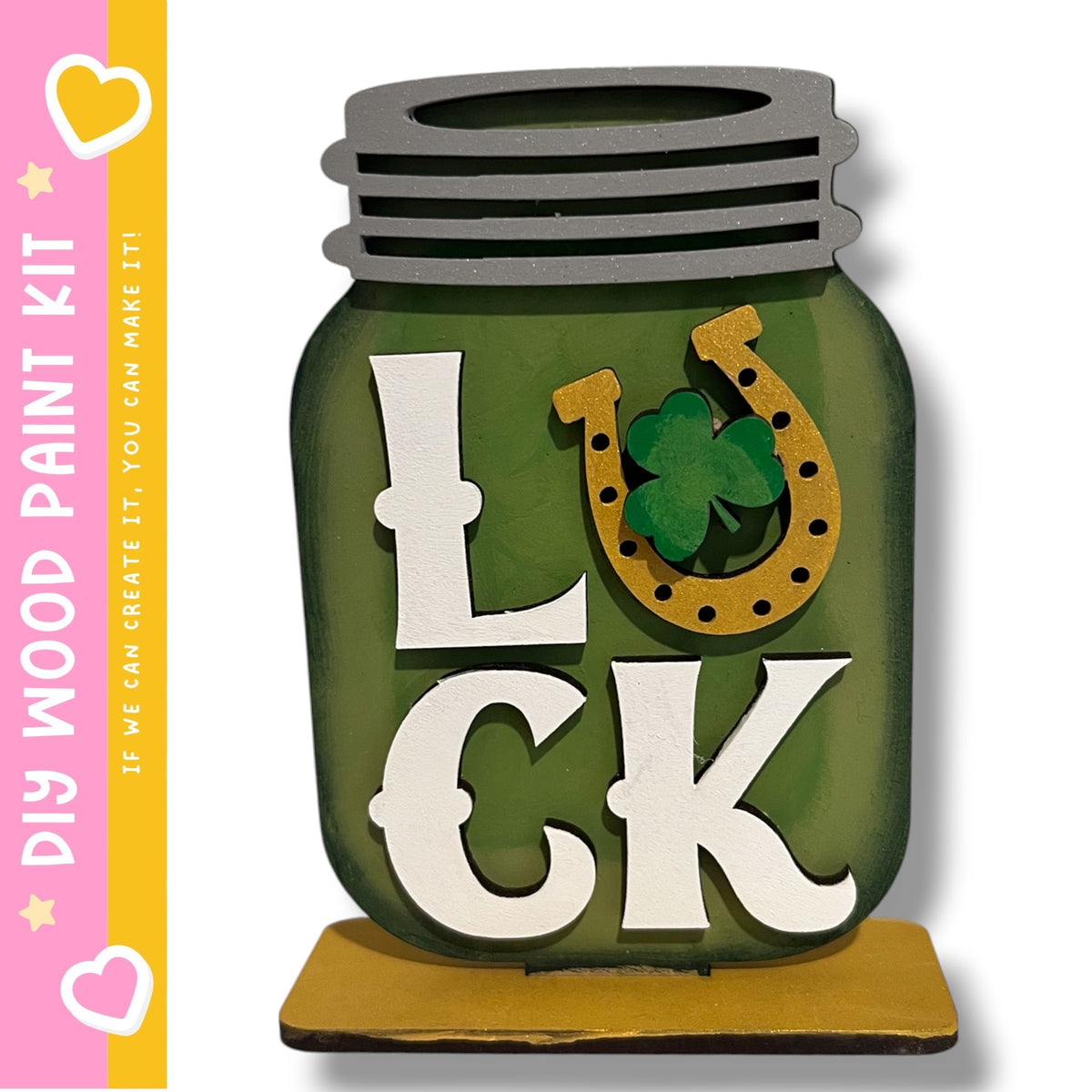 A green glass jar with the word "LUCK" written on it, along with a horseshoe symbol.