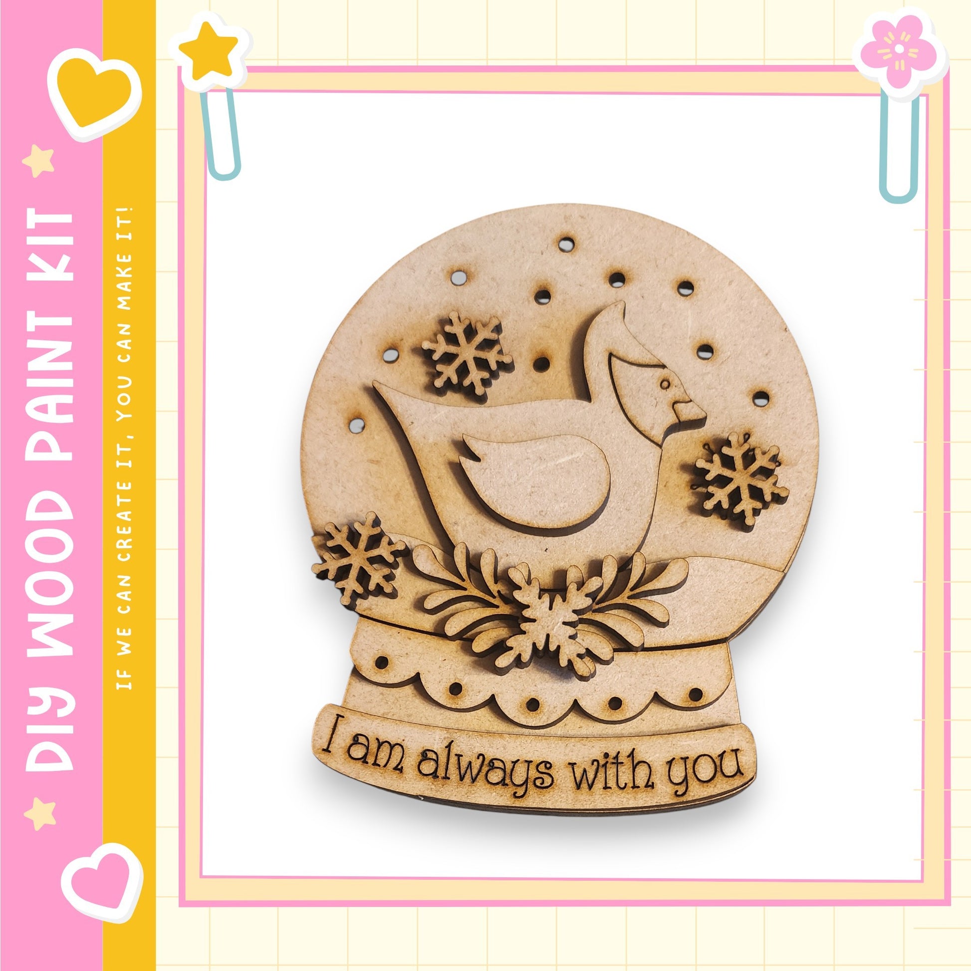 A wooden snow globe with a bird and snowflakes, along with the text "I am always with you" on the base.