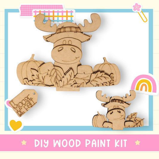 a DIY wood paint kit with a moose and pumpkins as the main subjects.