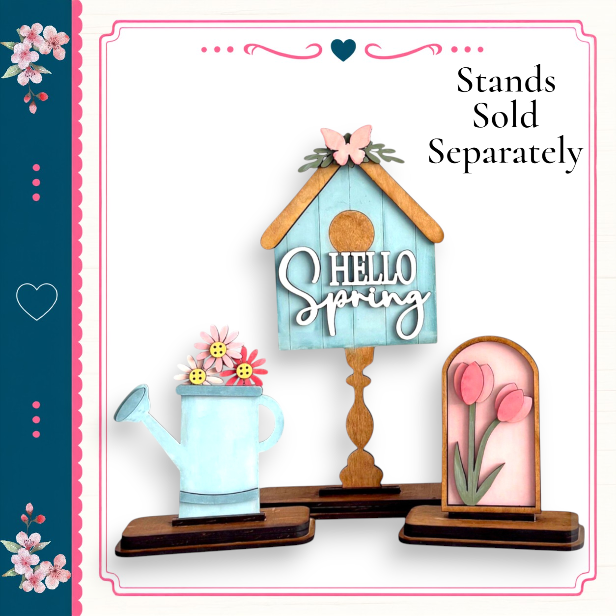 a wooden birdhouse with a "Hello Spring" sign on top, a blue watering can with flowers, and a pink flower arrangement. The birdhouse and watering can are placed on a wooden stand, and the pink flower arrangement is displayed in a frame.