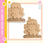 two wooden cutouts of sheep, each with a flower attached to its head. The sheep are positioned on a grassy surface, creating a charming and whimsical scene.