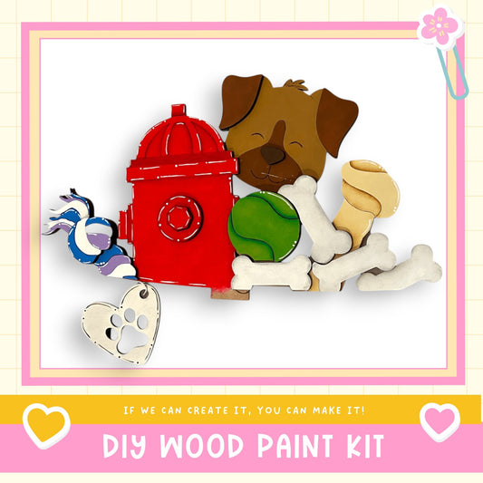 a red fire hydrant sitting next to a pile of dog toys