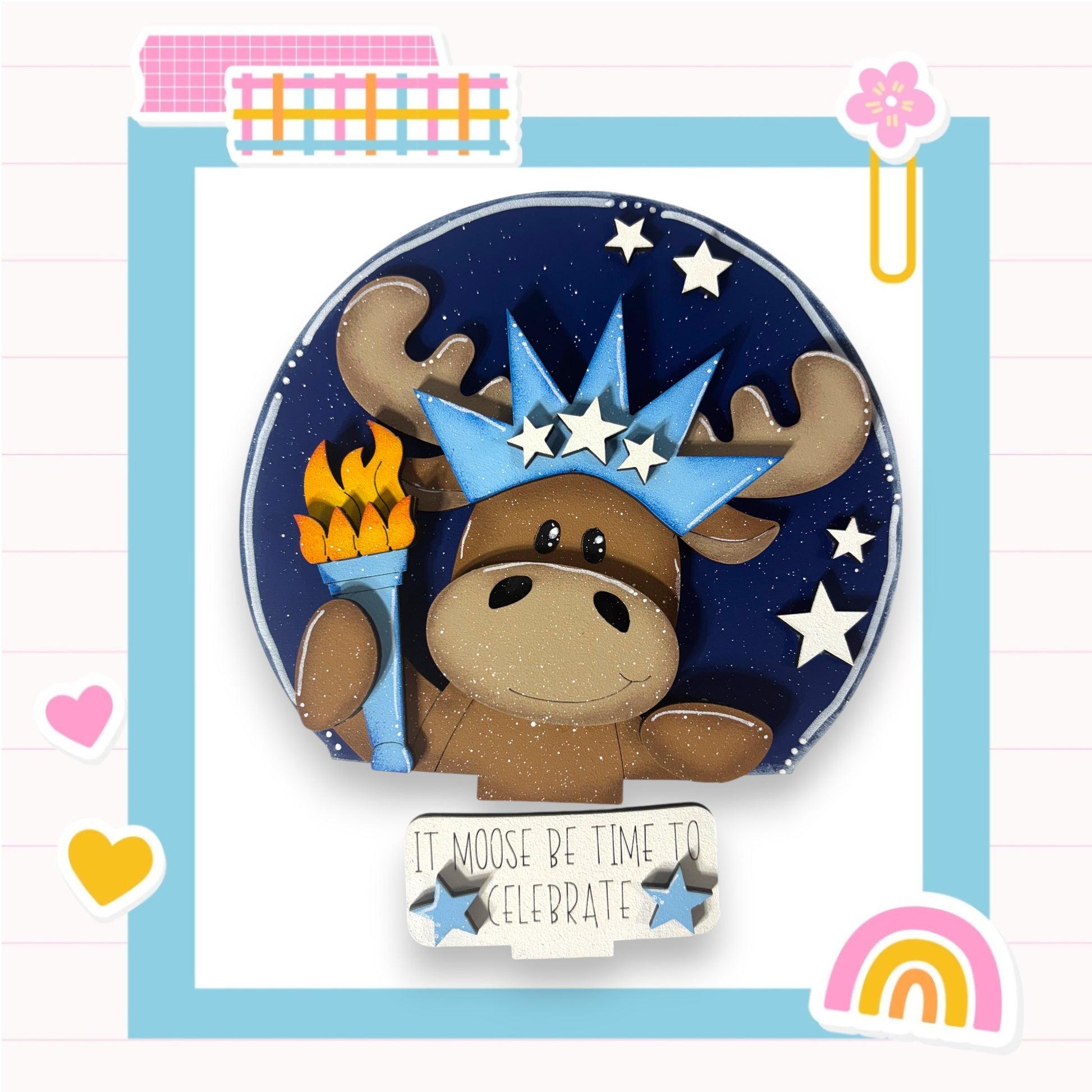 A cartoon moose wearing a crown and holding a torch, surrounded by stars and a rainbow, with the text "It moose be time to celebrate" below.