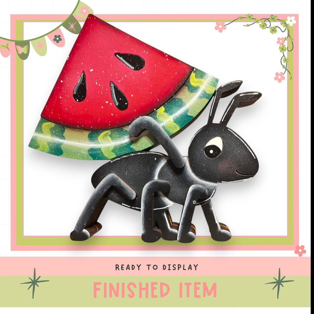 a black ant carrying a red watermelon slice on its back, with a pink and green border and decorative elements.