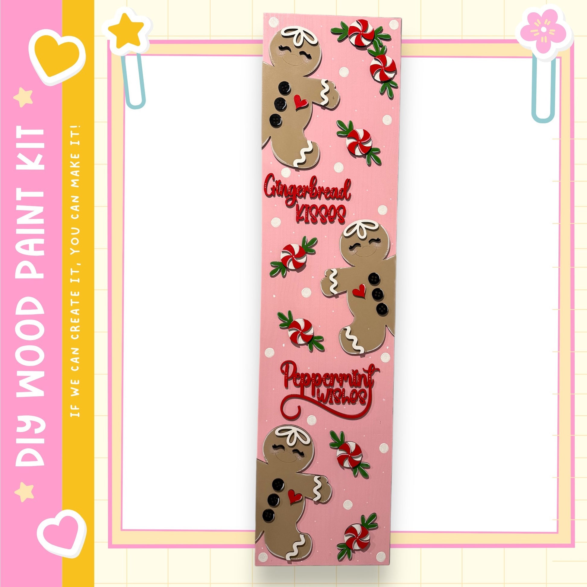A pink and yellow frame with a decorative border, featuring a large gingerbread man and peppermint candies.