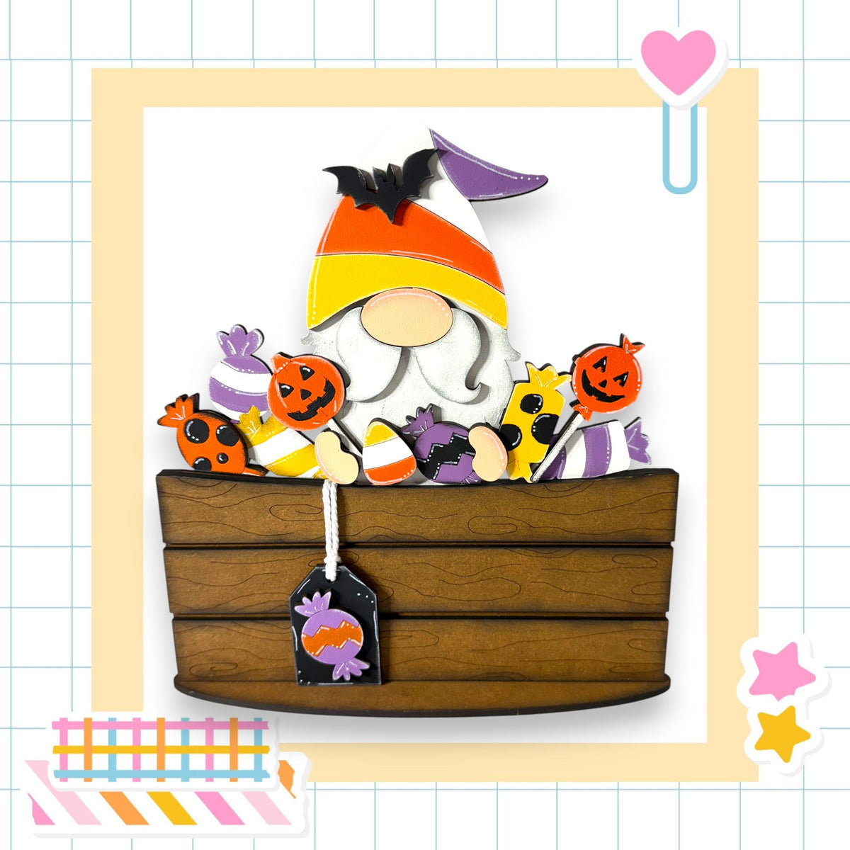 A wooden basket filled with Halloween-themed candy, including a gnome figure, is the central focus of the image.