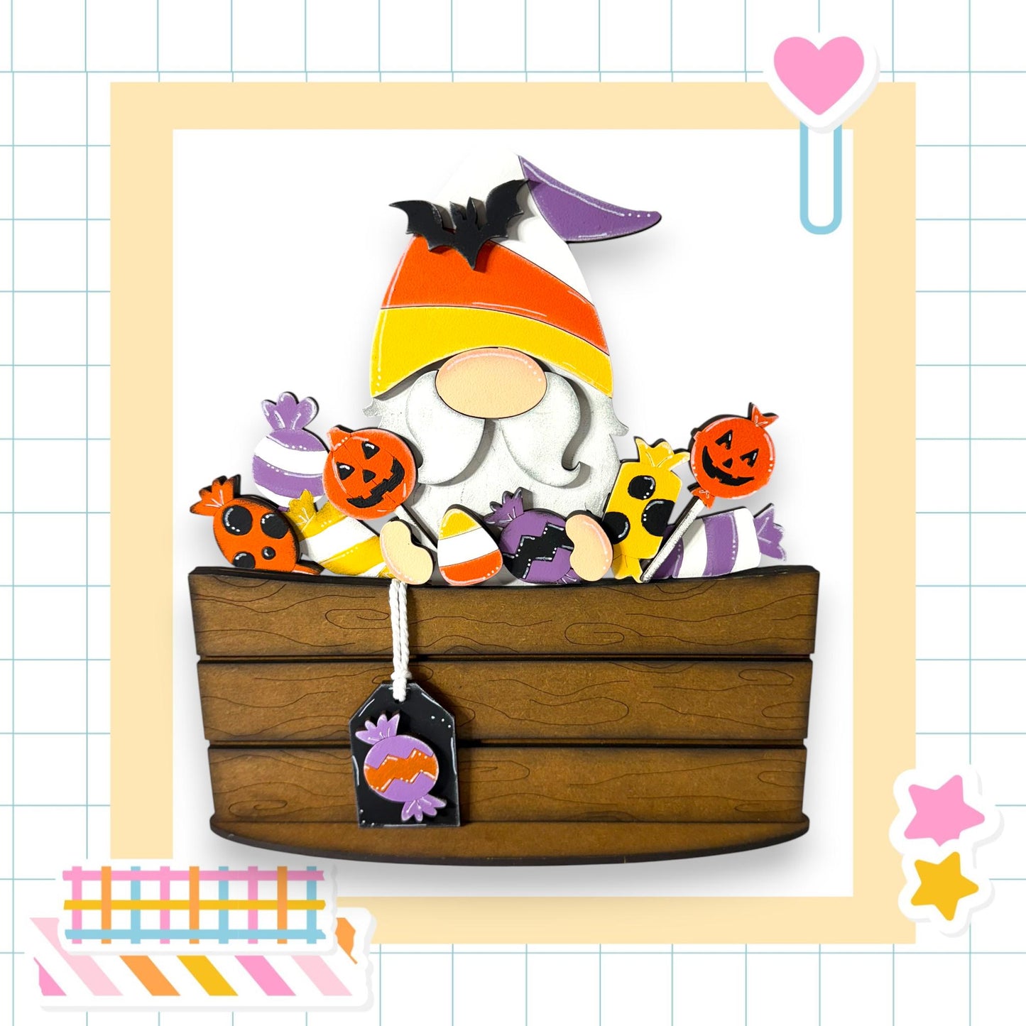 A wooden basket filled with Halloween-themed candy, including a gnome figure, is the central focus of the image.