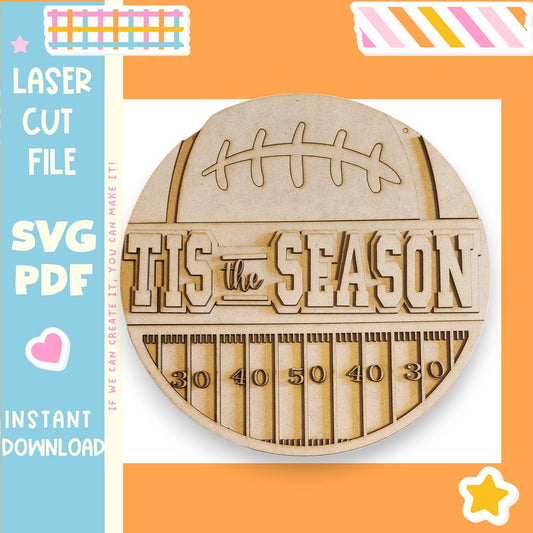 The image is a circular wooden sign with the text "TIS the SEASON" carved into it, surrounded by a colorful border.