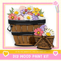 a DIY wood paint kit, with a wooden basket filled with colorful flowers and a smaller wooden basket with flowers. The text below the image encourages viewers to "If we can create it, you can make it!"