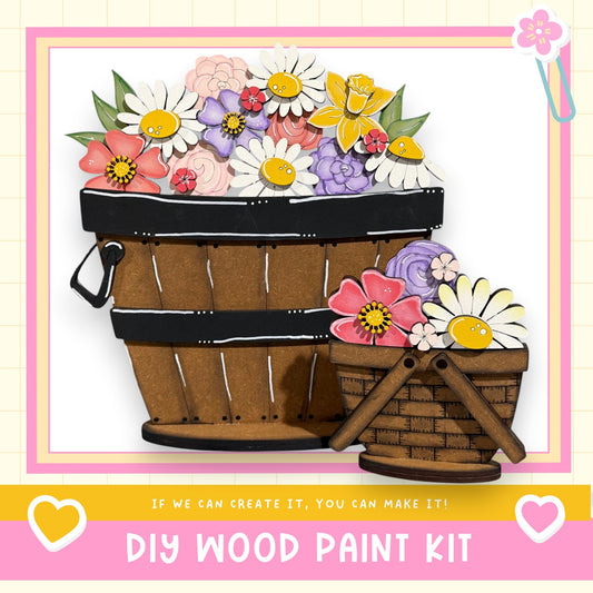 a DIY wood paint kit, with a wooden basket filled with colorful flowers and a smaller wooden basket with flowers. The text below the image encourages viewers to "If we can create it, you can make it!"