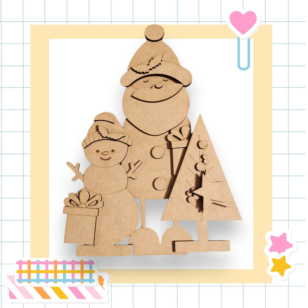 A cardboard snowman and a cardboard Christmas tree are depicted in the image, set against a grid background with various colorful stickers.