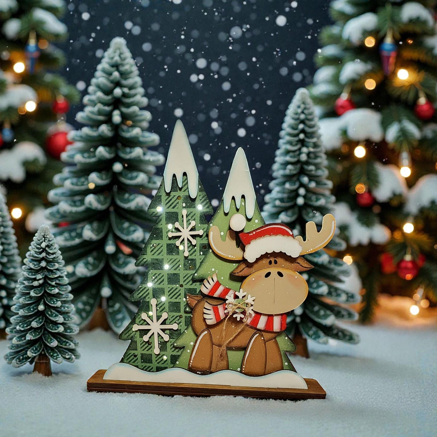 A wooden Christmas tree with a moose figure wearing a Santa hat stands in the foreground, surrounded by other Christmas trees and decorations.