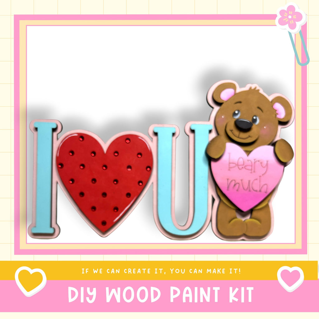 a wooden paint kit with a teddy bear holding a heart-shaped sign that says "I love you".