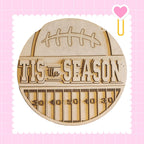 A wooden sign with the text "TIS THE SEASON" and a football graphic, surrounded by a grid pattern.