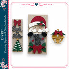 a DIY kit for creating Christmas decorations, including a wooden Santa Claus figure, a Christmas tree, and a bell ornament.