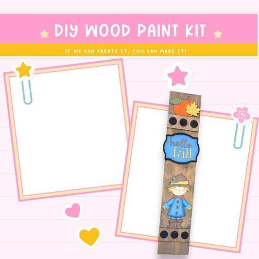 The image is a DIY wood paint kit with a blank white canvas, a wooden frame with a fall-themed design, and various decorative elements such as hearts and a star.