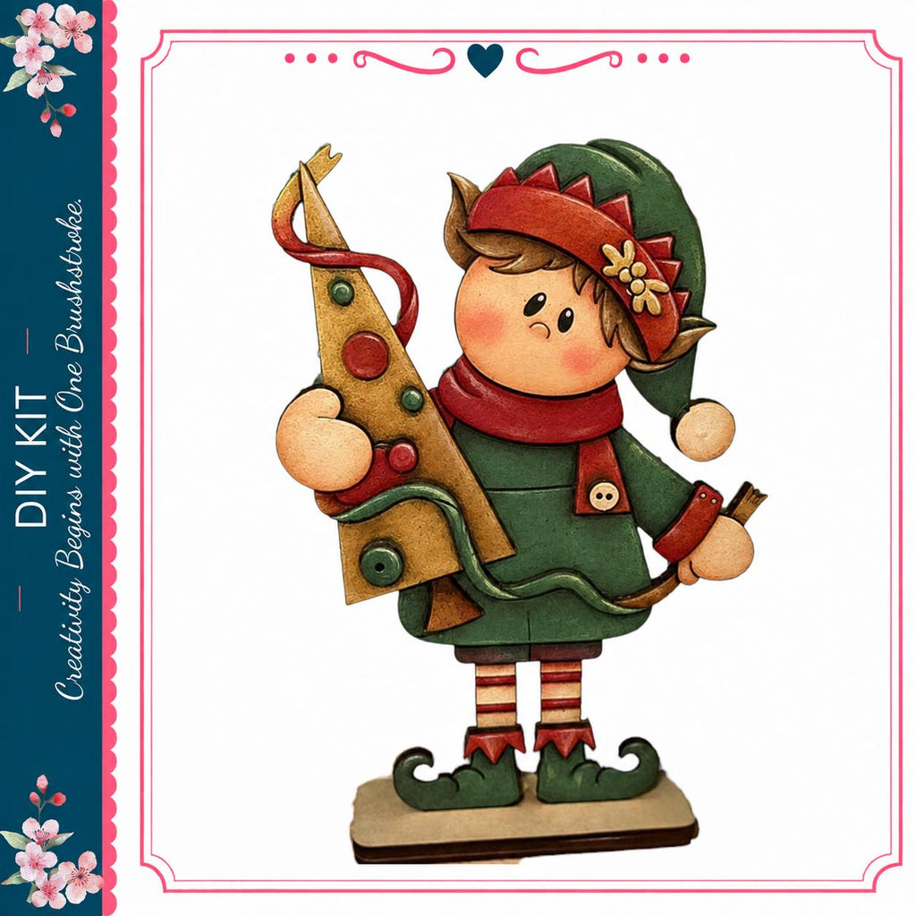 A wooden elf figurine holding a Christmas tree, wearing a green outfit with red and gold accents.