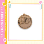 a wooden pendant with a heart and a star design, set against a pink and yellow background with a frame.