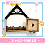 a wooden paint kit with a picture of a house