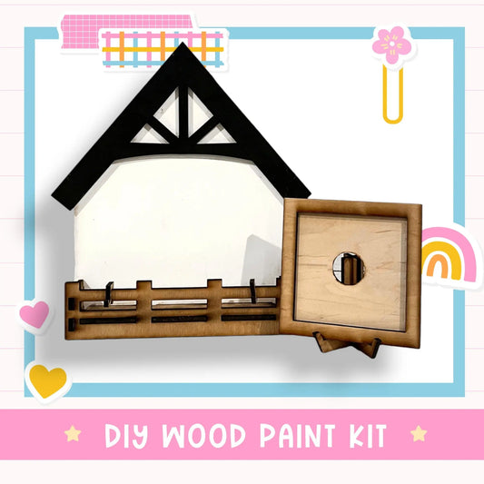 a wooden paint kit with a picture of a house