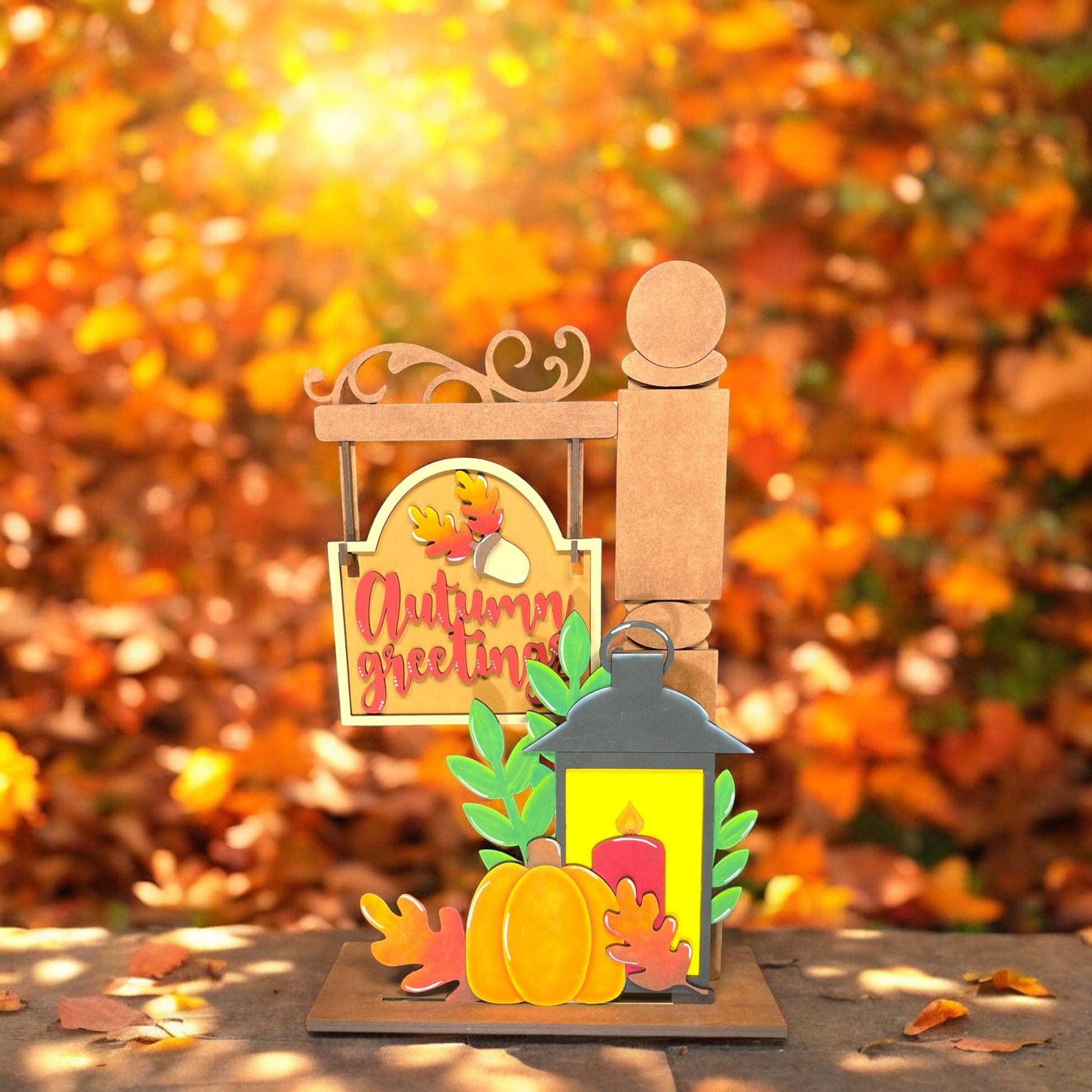 a card with a lantern and fall leaves