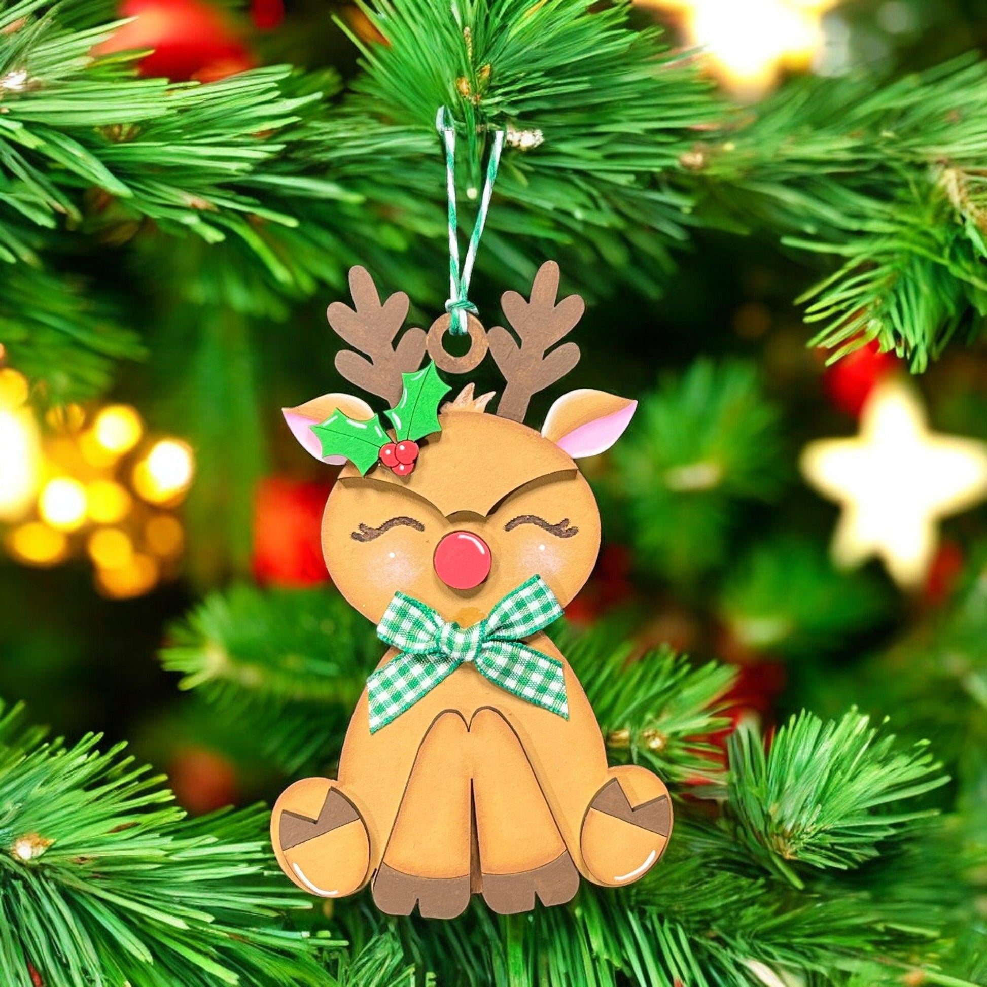 a christmas ornament hanging from a christmas tree