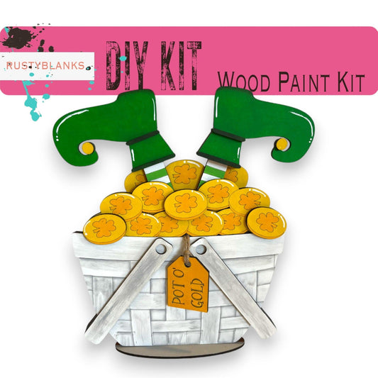 a wooden paint kit with scissors and a basket of gold coins