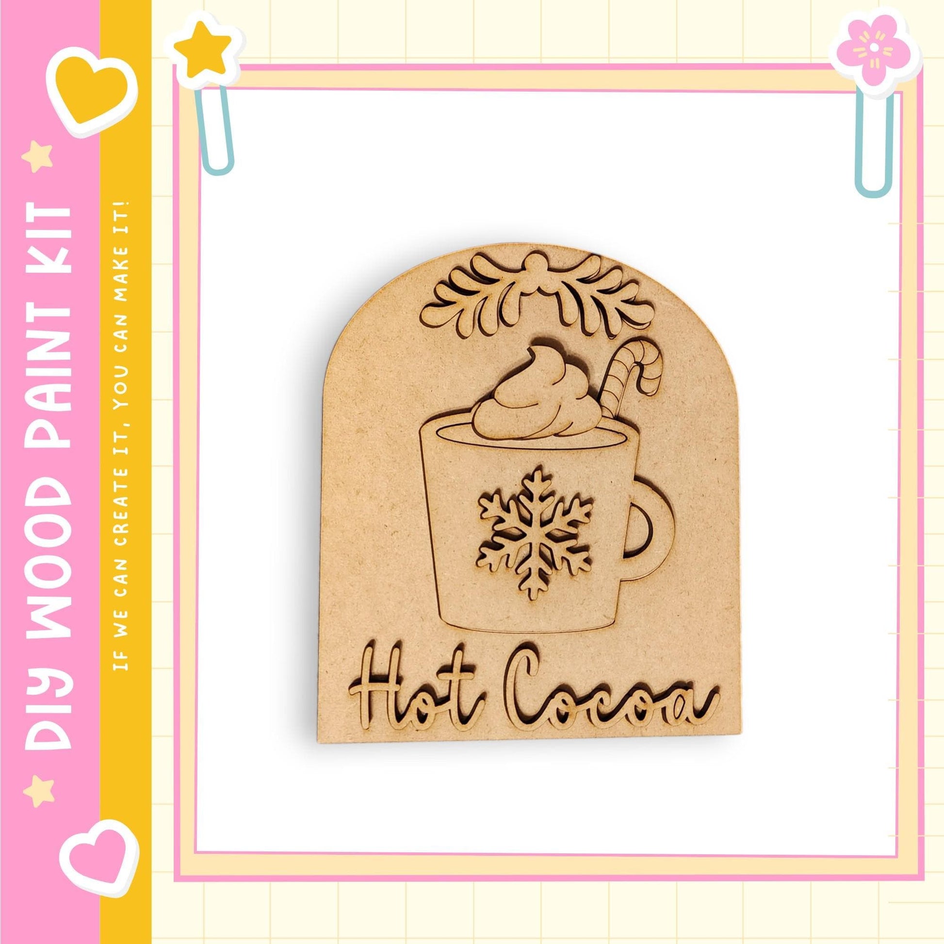 A wooden paint kit with a snowflake design and the word "Hot Cocoa" written on it.