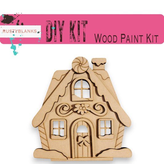 a wooden cutout of a house with the words diy kit