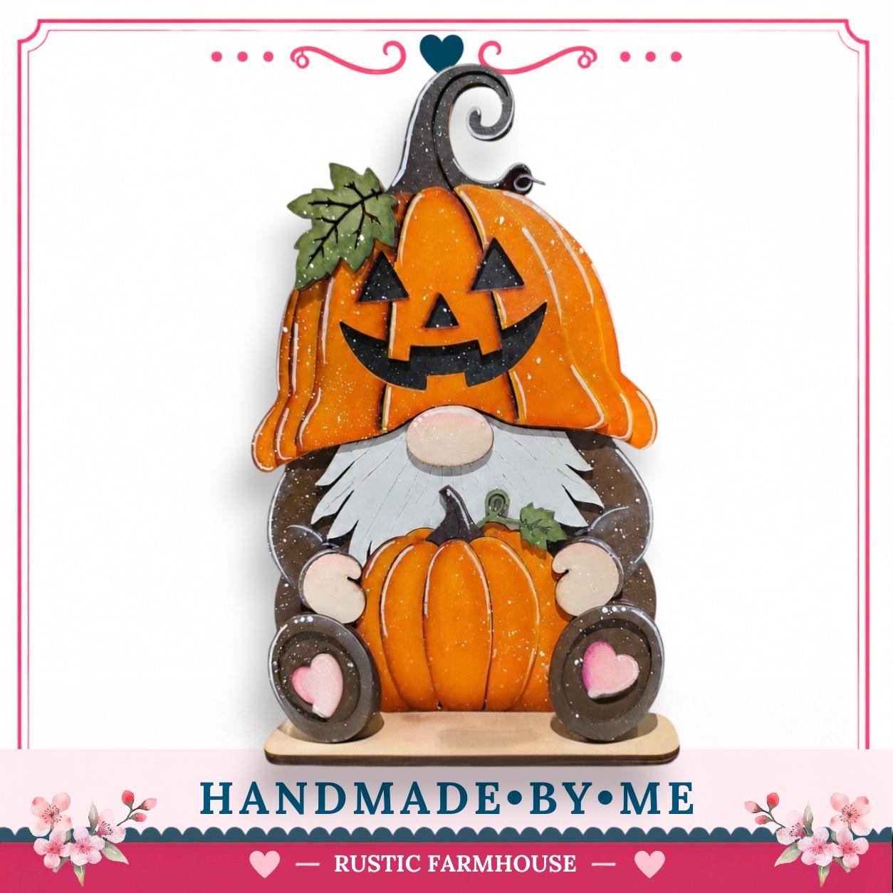 A handcrafted wooden gnome figure with a carved pumpkin head and a carved pumpkin body, sitting on a wooden base.