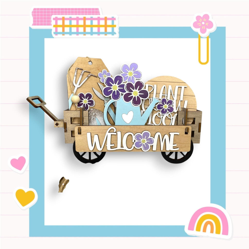 a wooden wagon with flowers and a welcome sign