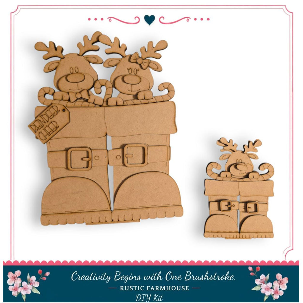 a DIY kit for creating wooden reindeer figures, including a pair of large reindeer and a smaller reindeer. The kit appears to be made of cardboard and is designed for crafting reindeer figures as a creative project.
