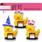 three rubber ducks with hats on their heads
