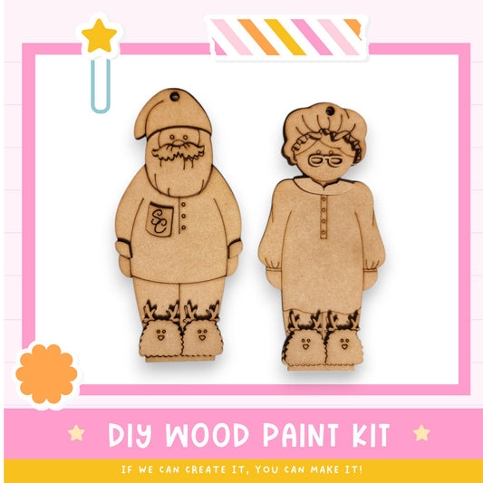 a pair of wooden cut outs of two people