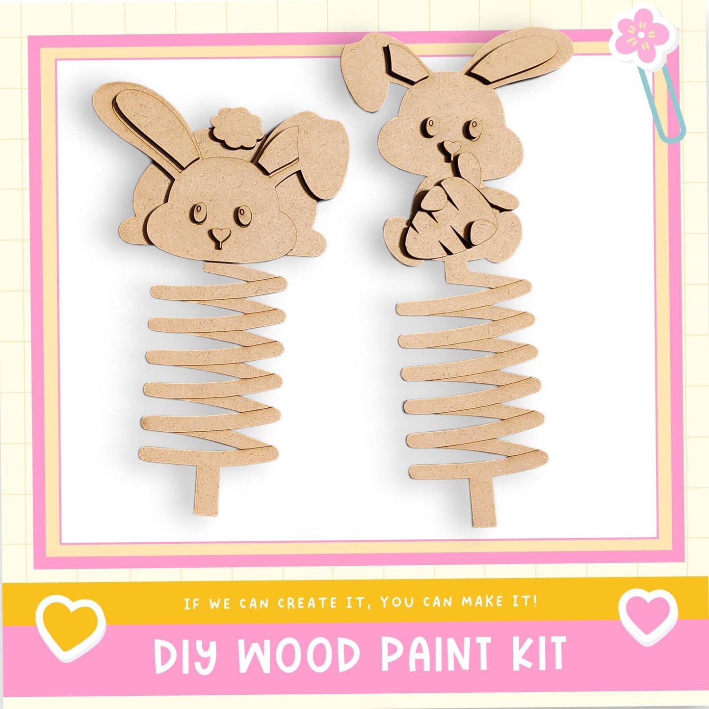 two wooden spring-like objects, resembling toy rabbits, with a pink and yellow border. The text below the image reads "DIY WOOD PAINT KIT" and "If we can create it, you can make it!"