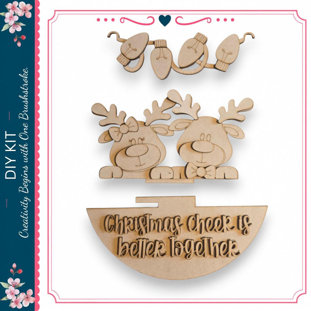 a DIY kit with a Christmas-themed decoration, including a pair of wooden reindeer, a wooden sign, and a wooden bow.