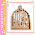 A wooden birdhouse with a bird design, surrounded by trees, is displayed in the image.