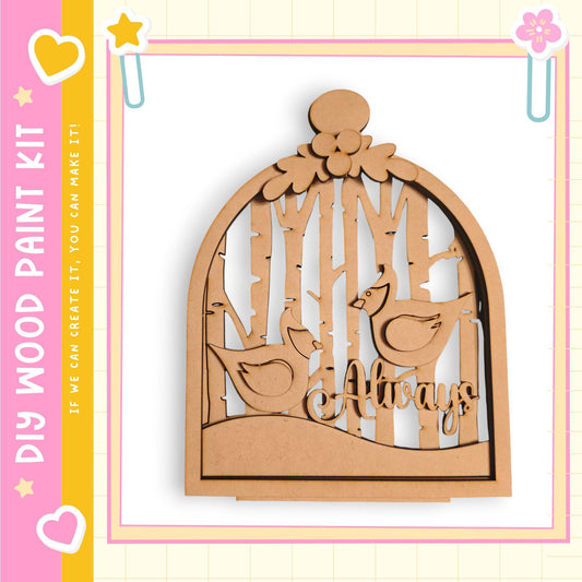 A wooden birdhouse with a bird design, surrounded by trees, is displayed in the image.