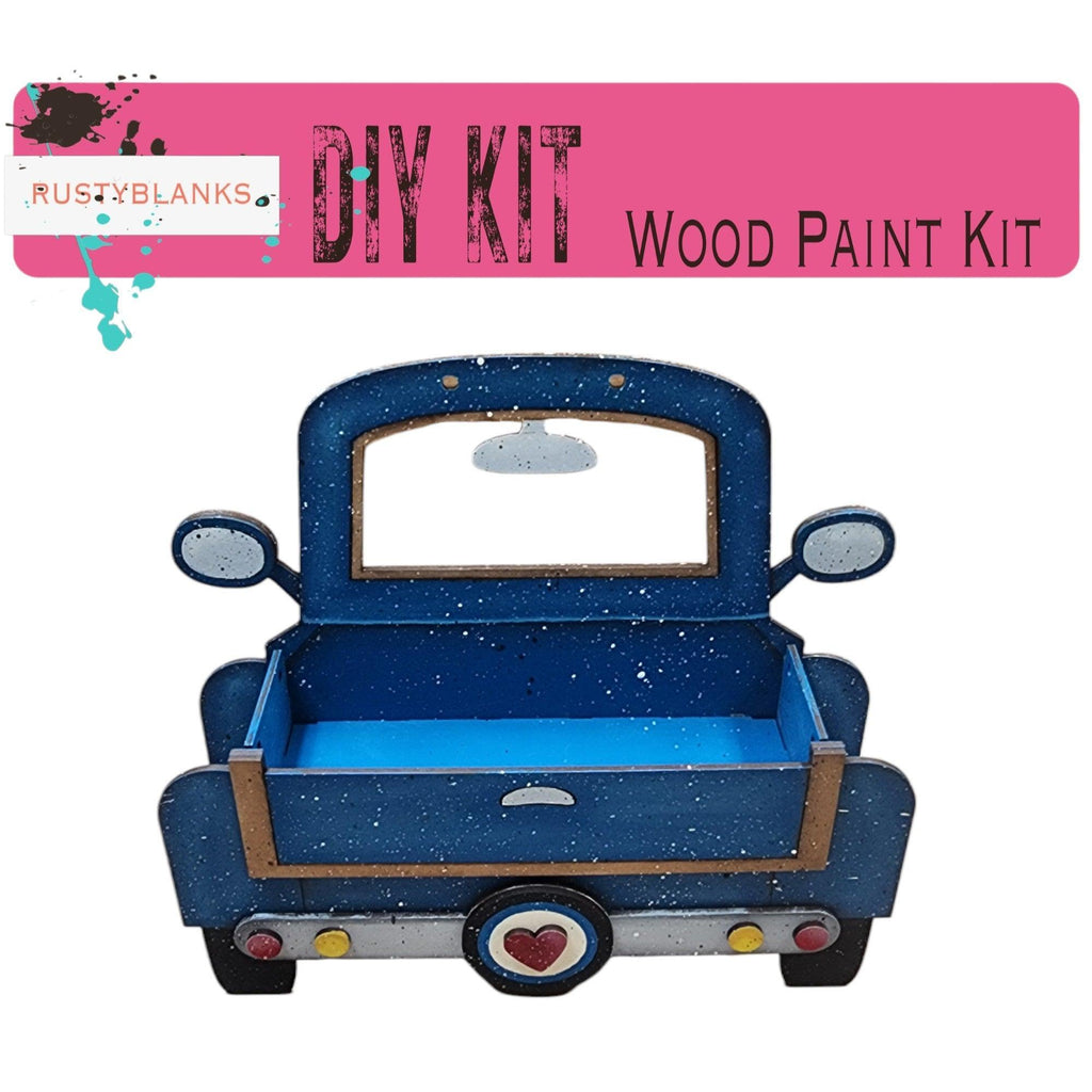 a wooden toy truck with a blue bed
