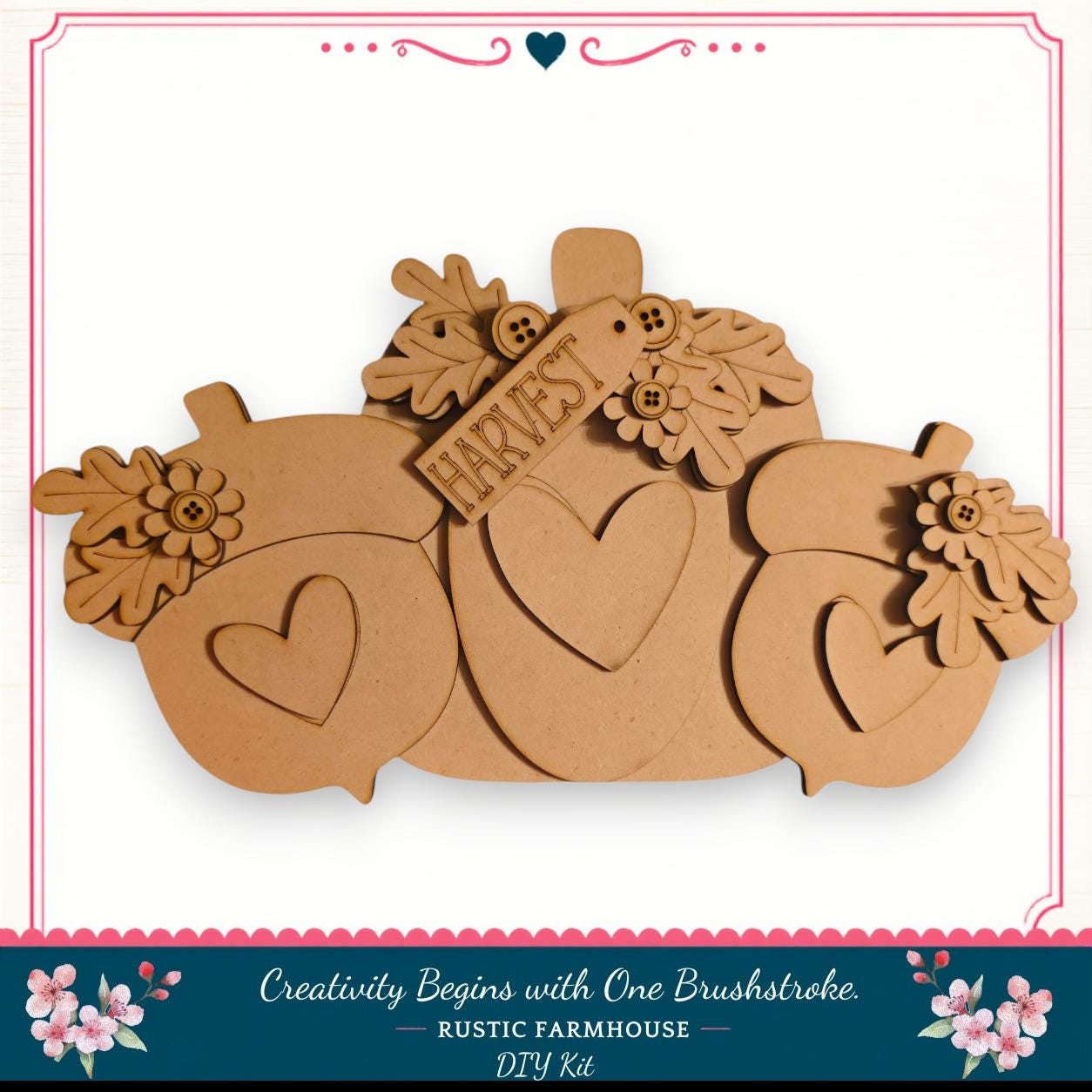A wooden pumpkin decoration with hearts and leaves, featuring the word "Harvest" on it. The pumpkin is part of a larger wooden decoration set, and the image is described as a DIY kit from a rustic farmhouse.