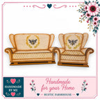 two beige armchairs with bee and honeycomb designs on them, set against a white background. The image is framed by a decorative border with floral elements.