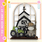 a wooden barn and a green tractor, with a smiling cow figure sitting next to the tractor.