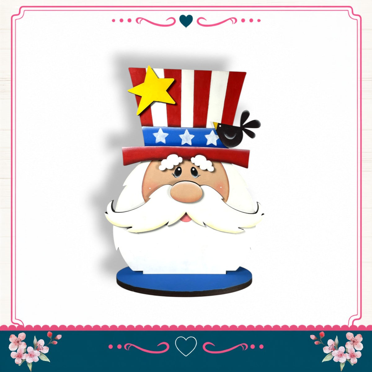 A cartoon-style Santa Claus figure wearing a patriotic hat with stars and stripes, a yellow star, and a black bird, set against a white background with a pink border and floral decorations.