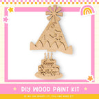 a wooden craft kit with a birthday cake