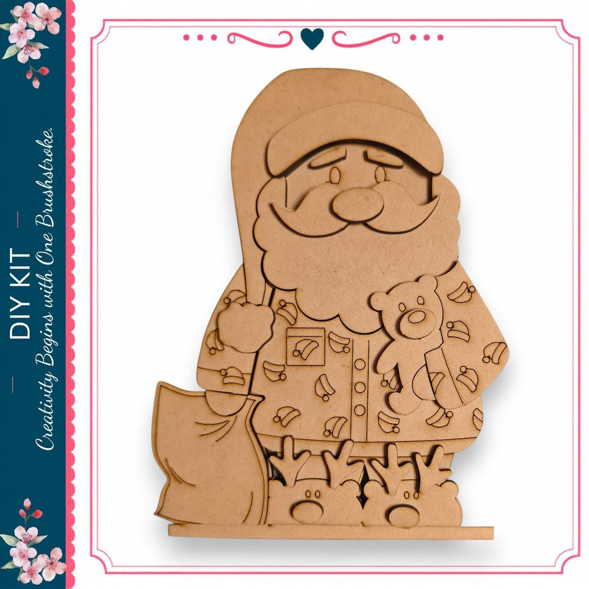 A wooden cutout of Santa Claus holding a teddy bear and a sack of presents, with a heart-shaped decoration above the figure.