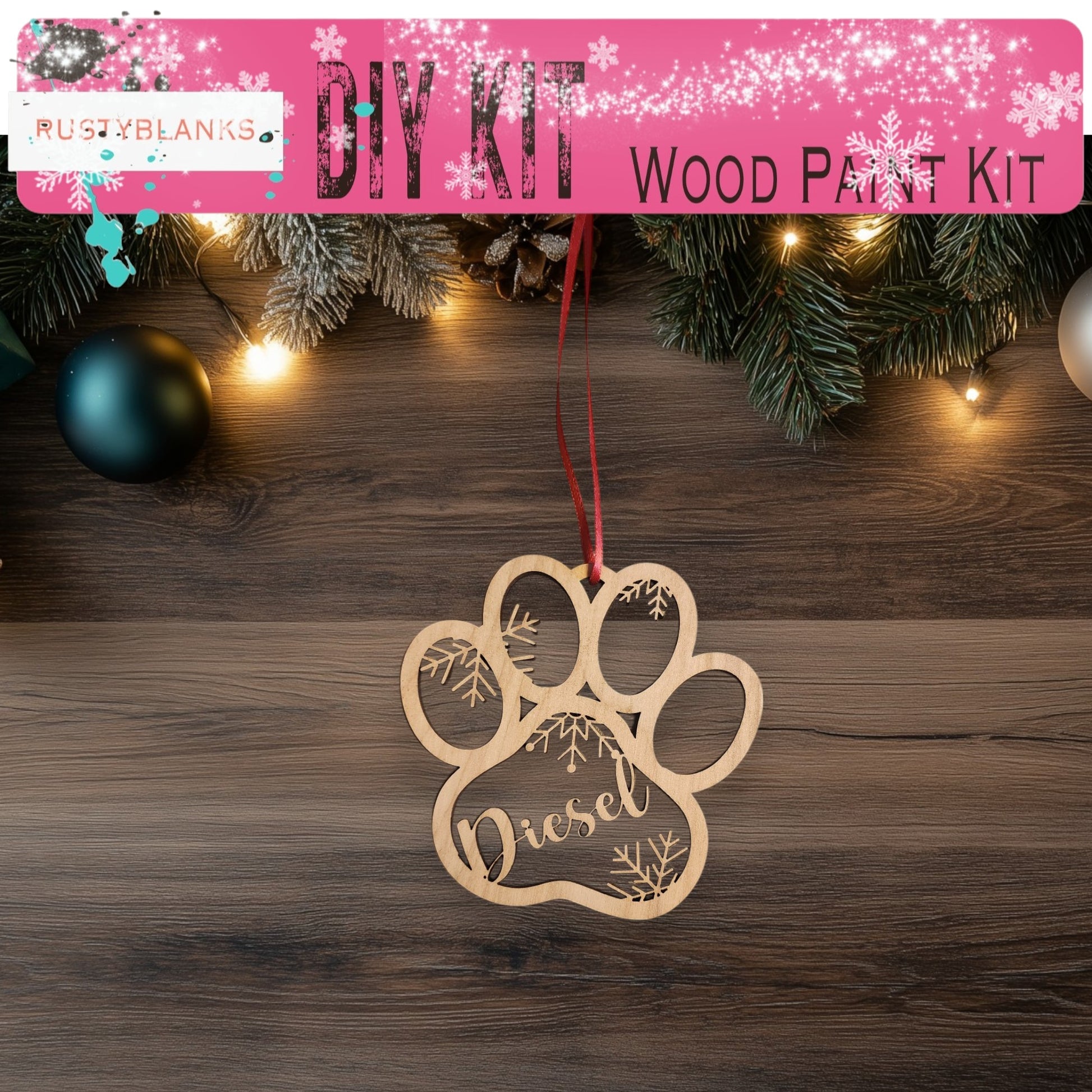 a dog paw ornament hanging from a christmas tree